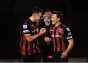 12 November 2021; Bohemians players Rob Cornwall, left, and Keith Buckley, right, with first team player development coach Derek Pender, behind, celebrate after their side's victory in the SSE Airtricity League Premier Division match between Bohemians and Shamrock Rovers at Dalymount Park in Dublin. Photo by Seb Daly/Sportsfile