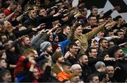 12 November 2021; Bohemians supporters celebrate their side's victory in the SSE Airtricity League Premier Division match between Bohemians and Shamrock Rovers at Dalymount Park in Dublin. Photo by Ramsey Cardy/Sportsfile