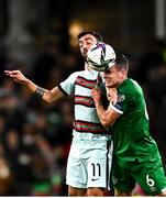 11 November 2021; Josh Cullen of Republic of Ireland in action against Bruno Fernandes of Portugal during the FIFA World Cup 2022 qualifying group A match between Republic of Ireland and Portugal at the Aviva Stadium in Dublin. Photo by Eóin Noonan/Sportsfile