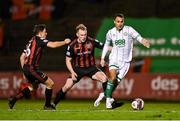 12 November 2021; Graham Burke of Shamrock Rovers in action against Ciarán Kelly, centre, and Keith Buckley of Bohemians during the SSE Airtricity League Premier Division match between Bohemians and Shamrock Rovers at Dalymount Park in Dublin. Photo by Seb Daly/Sportsfile
