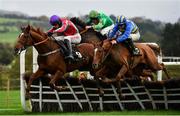 13 November 2021; Captain Conby, right, with Kevin Sexton up, jumps the last on their way to winning the BetVictor Maiden Hurdle, from third place Happy Du Mesnil, left, with Danny Mullins up, during day one of the Punchestown Winter Festival at Punchestown Racecourse in Kildare. Photo by Seb Daly/Sportsfile