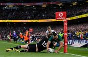 13 November 2021; James Lowe of Ireland dives over to score his side's first try despite the tackle of Jordie Barrett of New Zealand during the Autumn Nations Series match between Ireland and New Zealand at Aviva Stadium in Dublin. Photo by Brendan Moran/Sportsfile