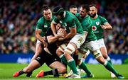 13 November 2021; Ireland players, from left, James Lowe, Caelan Doris and Jack Conan hold up Will Jordan of New Zealand to force a turnover during the Autumn Nations Series match between Ireland and New Zealand at Aviva Stadium in Dublin. Photo by Brendan Moran/Sportsfile