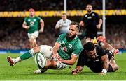 13 November 2021; Jamison Gibson-Park of Ireland gets to the ball ahead of Sevu Reece of New Zealand to prevent a try during the Autumn Nations Series match between Ireland and New Zealand at Aviva Stadium in Dublin. Photo by Brendan Moran/Sportsfile