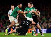 13 November 2021; Hugo Keenan of Ireland is tackled by Jordie Barrett and Finlay Christie of New Zealand during the Autumn Nations Series match between Ireland and New Zealand at Aviva Stadium in Dublin. Photo by Brendan Moran/Sportsfile