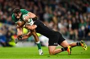 13 November 2021; Hugo Keenan of Ireland is tackled by David Havili of New Zealand during the Autumn Nations Series match between Ireland and New Zealand at Aviva Stadium in Dublin. Photo by Ramsey Cardy/Sportsfile