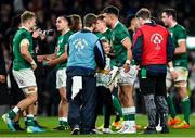13 November 2021; Conor Murray of Ireland gives his boots to a young Ireland supporter after the Autumn Nations Series match between Ireland and New Zealand at Aviva Stadium in Dublin. Photo by Ramsey Cardy/Sportsfile