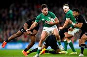 13 November 2021; Hugo Keenan of Ireland is tackled by Sevu Reece, left and David Havili of New Zealand during the Autumn Nations Series match between Ireland and New Zealand at Aviva Stadium in Dublin. Photo by Ramsey Cardy/Sportsfile