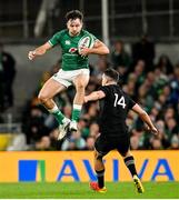 13 November 2021; Hugo Keenan of Ireland beats Will Jordan of New Zealand to the ball during the Autumn Nations Series match between Ireland and New Zealand at Aviva Stadium in Dublin. Photo by Ramsey Cardy/Sportsfile