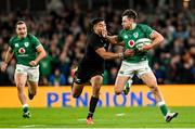 13 November 2021; Hugo Keenan of Ireland is tackled by Rieko Ioane of New Zealand during the Autumn Nations Series match between Ireland and New Zealand at Aviva Stadium in Dublin. Photo by Ramsey Cardy/Sportsfile