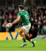 13 November 2021; Hugo Keenan of Ireland is tackled by Rieko Ioane of New Zealand during the Autumn Nations Series match between Ireland and New Zealand at Aviva Stadium in Dublin. Photo by Ramsey Cardy/Sportsfile