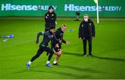 13 November 2021; Andrew Omobamidele goes through a fitness test with physiotherapist Danny Miller while being watched by team doctor Alan Byrne, right, and athletic therapist Colum O’Neill, left, during a Republic of Ireland training session at Stade de Luxembourg in Luxembourg. Photo by Stephen McCarthy/Sportsfile