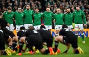 13 November 2021;  Ireland players, from left, Josh van der Flier, Rob Herring, Iain Henderson, Joey Carbery, Garry Ringrose, Keith Earls, Jamison Gibson-Park and Peter O’Mahony watch New Zealand perform the Haka before the Autumn Nations Series match between Ireland and New Zealand at Aviva Stadium in Dublin. Photo by Ramsey Cardy/Sportsfile