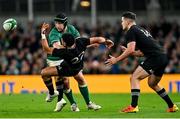 13 November 2021; Richie Mo'unga of New Zealand is tackled by Caelan Doris of Ireland during the Autumn Nations Series match between Ireland and New Zealand at Aviva Stadium in Dublin. Photo by Ramsey Cardy/Sportsfile