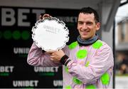 14 November 2021; Jockey Patrick Mullins with the trophy after riding Sharjah to victory in the Unibet Morgiana Hurdle during day two of the Punchestown Winter Festival at Punchestown Racecourse in Kildare. Photo by Seb Daly/Sportsfile