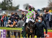 14 November 2021; Jockey Patrick Mullins celebrates as he enters the winners enclosure after riding Sharjah to victory in the Unibet Morgiana Hurdle during day two of the Punchestown Winter Festival at Punchestown Racecourse in Kildare. Photo by Seb Daly/Sportsfile