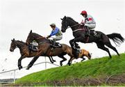 14 November 2021; Runners and riders, from left, Midnight Maestro, with Mark Walsh up, Rolling Revenge, with Adam Short up, and Robin Des Foret, with Ben Harvey up, jump Ruby's Double during the Pigsback.com Risk Of Thunder Steeplechase on day two of the Punchestown Winter Festival at Punchestown Racecourse in Kildare. Photo by Seb Daly/Sportsfile