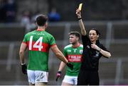 14 November 2021; Referee Maggie Farrelly issues a yellow card to Conor Madden, 14, of Gowna during the Cavan County Senior Club Football Championship Final Replay match between Gowna and Ramor United at Kingspan Breffni in Cavan. Photo by Ben McShane/Sportsfile