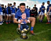 14 November 2021; Paul McConway of Tullamore with his daughter Ailbhe, aged 5 months, in the trophy after the Offaly County Senior Club Football Championship Final replay match between Rhode and Tullamore at Bord Na Móna O'Connor Park in Tullamore, Offaly. Photo by Harry Murphy/Sportsfile