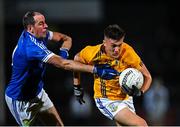 14 November 2021; Odhran Raerty of Dromore is tackled by Plunkett Kane of Coalisland during the Tyrone County Senior Club Football Championship Final match between Coalisland and Dromore at O’Neills Healy Park in Omagh, Tyrone. Photo by Ramsey Cardy/Sportsfile