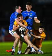 14 November 2021; Colm O'Neill of Dromore is tackled by Plunkett Kane of Coalisland during the Tyrone County Senior Club Football Championship Final match between Coalisland and Dromore at O’Neills Healy Park in Omagh, Tyrone. Photo by Ramsey Cardy/Sportsfile