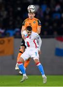 14 November 2021; John Egan of Republic of Ireland in action against Danel Sinani of Luxembourg during the FIFA World Cup 2022 qualifying group A match between Luxembourg and Republic of Ireland at Stade de Luxembourg in Luxembourg. Photo by Stephen McCarthy/Sportsfile