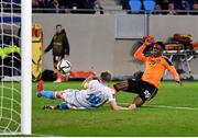 14 November 2021; Chiedozie Ogbene of Republic of Ireland shoots to score his side's second goal despite the efforts of Laurent Jans of Luxembourg during the FIFA World Cup 2022 qualifying group A match between Luxembourg and Republic of Ireland at Stade de Luxembourg in Luxembourg. Photo by Stephen McCarthy/Sportsfile