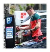 22 May 2021; Messi doesn’t have to do this. With extra precautions required to combat Covid, some counties avoid travelling in team buses so Mayo’s Jordan Flynn ends up buying his own parking ticket in Mullingar. The amateur ethos is preserved – it’s not pay for play, it’s pay to play. Photo by Stephen McCarthy/Sportsfile This image may be reproduced free of charge when used in conjunction with a review of the book &quot;A Season of Sundays 2020&quot;. All other usage © Sportsfile