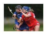 15 May 2021; Always keep your eye on the ball. Jill Ann Quirke of Tipperary and Cork’s Kate Kilcommins stretch every sinew while maintaining their concentration in a full-blooded race for the sliotar. Photo by David Fitzgerald/Sportsfile This image may be reproduced free of charge when used in conjunction with a review of the book &quot;A Season of Sundays 2020&quot;. All other usage © Sportsfile