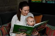 15 November 2021; Senan Daly, aged seven months, from Glasnevin, Dublin, reads A Season of Sundays with his Mother Colleen Fahey at the launch of A Season of Sundays 2021 at Croke Park Hotel in Dublin. Photo by Harry Murphy/Sportsfile