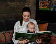 15 November 2021; Senan Daly, aged seven months, from Glasnevin, Dublin, reads A Season of Sundays with his Mother Colleen Fahey at the launch of A Season of Sundays 2021 at Croke Park Hotel in Dublin. Photo by Harry Murphy/Sportsfile