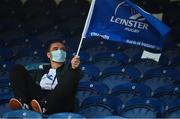 11 June 2021; James Lowe of Leinster waves a flag while watching the game from the stand during the Guinness PRO14 match between Leinster and Dragons at RDS Arena in Dublin. The game is one of the first of a number of pilot sports events over the coming weeks which are implementing guidelines set out by the Irish government to allow for the safe return of spectators to sporting events. Photo by Brendan Moran/Sportsfile