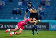 11 June 2021; Caelan Doris of Leinster is tackled by Gonzalo Bertranou of Dragons during the Guinness PRO14 match between Leinster and Dragons at RDS Arena in Dublin. The game is one of the first of a number of pilot sports events over the coming weeks which are implementing guidelines set out by the Irish government to allow for the safe return of spectators to sporting events. Photo by Brendan Moran/Sportsfile