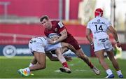 3 April 2021; Chris Farrell of Munster is tackled by Dimitri Delibes of Toulouse during the Heineken Champions Cup Round of 16 match between Munster and Toulouse at Thomond Park in Limerick. Photo by Brendan Moran/Sportsfile