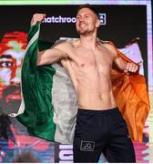 18 November 2021; Jason Quigley with the Irish tri-colour during the weigh-ins ahead of his WBO World Middleweight Title fight against Demetrius Andrade at the SNHU Arena in Manchester, New Hampshire, USA. Photo by Ed Mullholland / Matchroom Boxing via Sportsfile