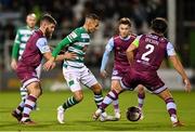 19 November 2021; Graham Burke of Shamrock Rovers in action against Drogheda United players, from left, Gary Deegan, Darragh Markey and James Brown during the SSE Airtricity League Premier Division match between Shamrock Rovers and Drogheda United at Tallaght Stadium in Dublin. Photo by Seb Daly/Sportsfile