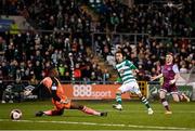 19 November 2021; Graham Burke of Shamrock Rovers shoots to score his side's first goal past Drogheda United goalkeeper David Odumosu during the SSE Airtricity League Premier Division match between Shamrock Rovers and Drogheda United at Tallaght Stadium in Dublin. Photo by Stephen McCarthy/Sportsfile