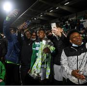 19 November 2021; Aidomo Emakhu of Shamrock Rovers celebrates with the SSE Airtricity League Premier Division trophy after their match against Drogheda United at Tallaght Stadium in Dublin. Photo by Stephen McCarthy/Sportsfile