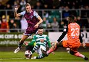 19 November 2021; Danny Mandroiu of Shamrock Rovers in action against Killian Phillips, left, and Drogheda United goalkeeper David Odumosu during the SSE Airtricity League Premier Division match between Shamrock Rovers and Drogheda United at Tallaght Stadium in Dublin. Photo by Seb Daly/Sportsfile