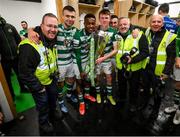 19 November 2021; Shamrock Rovers players, from left, Adam Wells, Aidomo Emakhu, Conan Noonan and Dean McMenemy and Shamrock Rovers photographers Andrew O'Connell, George Kelly and Robert Goggins celebrate with the SSE Airtricity League Premier Division trophy after their match against Drogheda United at Tallaght Stadium in Dublin. Photo by Stephen McCarthy/Sportsfile