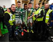 19 November 2021; Shamrock Rovers players, from left, Adam Wells, Aidomo Emakhu, Conan Noonan and Dean McMenemy and Shamrock Rovers photographers Andrew O'Connell, George Kelly and Robert Goggins celebrate with the SSE Airtricity League Premier Division trophy after their match against Drogheda United at Tallaght Stadium in Dublin. Photo by Stephen McCarthy/Sportsfile