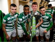 19 November 2021; Shamrock Rovers players, from left, Adam Wells, Aidomo Emakhu, Conan Noonan and Dean McMenemy celebrate with the SSE Airtricity League Premier Division trophy after their match against Drogheda United at Tallaght Stadium in Dublin. Photo by Stephen McCarthy/Sportsfile