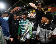 19 November 2021; Aidomo Emakhu of Shamrock Rovers and supporters celebrate with the SSE Airtricity League Premier Division trophy after their match against Drogheda United at Tallaght Stadium in Dublin. Photo by Stephen McCarthy/Sportsfile
