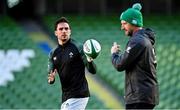 20 November 2021; Joey Carbery, left, takes a pass from assistant coach Mike Catt during the Ireland Captain's Run at Aviva Stadium in Dublin. Photo by Brendan Moran/Sportsfile