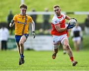 21 November 2021; James Kelly of Belmullet in action against Nathan Armstrong of Knockmore during the Mayo County Senior Club Football Championship Final match between Knockmore and Belmullet at James Stephen's Park in Ballina, Mayo. Photo by Piaras Ó Mídheach/Sportsfile