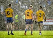 21 November 2021; Knockmore players, from left, Kieran King, Marcus Park and David McHale make their way off the pitch at half-time during a heavy rain shower at the Mayo County Senior Club Football Championship Final match between Knockmore and Belmullet at James Stephen's Park in Ballina, Mayo. Photo by Piaras Ó Mídheach/Sportsfile