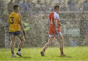 21 November 2021; David McHale of Knockmore and Ryan O'Donoghue of Belmullet look on during a heavy rain shower in the Mayo County Senior Club Football Championship Final match between Knockmore and Belmullet at James Stephen's Park in Ballina, Mayo. Photo by Piaras Ó Mídheach/Sportsfile