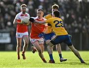 21 November 2021; Ryan O'Donoghue of Belmullet is tackled by Kevin McLaughlin of Knockmore during the Mayo County Senior Club Football Championship Final match between Knockmore and Belmullet at James Stephen's Park in Ballina, Mayo. Photo by Piaras Ó Mídheach/Sportsfile