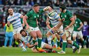 21 November 2021; Tadhg Furlong of Ireland offloads to team-mate Caelan Doris as he is tackled by Julian Montoya of Argentina during the Autumn Nations Series match between Ireland and Argentina at Aviva Stadium in Dublin. Photo by Brendan Moran/Sportsfile