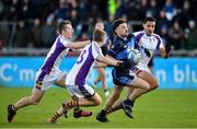 21 November 2021; Oisin Manning of St. Jude's in action against Kilmacud Crokes players, from left, Hugh Kenny, Conor Kingston, and Craig Dias during the Go Ahead Dublin County Senior Club Football Championship Final match between St Jude's and Kilmacud Crokes at Parnell Park in Dublin. Photo by Daire Brennan/Sportsfile